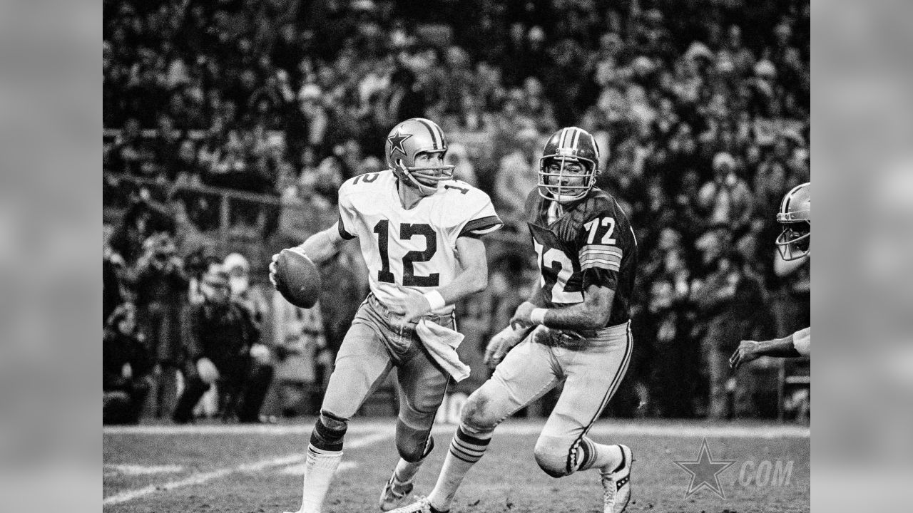 Dallas Cowboys quarterback Roger Staubach (12) is hit just as he releases  the ball by Washington Redskins right defensive tackle Diron Talbert (72)  during the NFC Championship game against the Dallas Cowboys