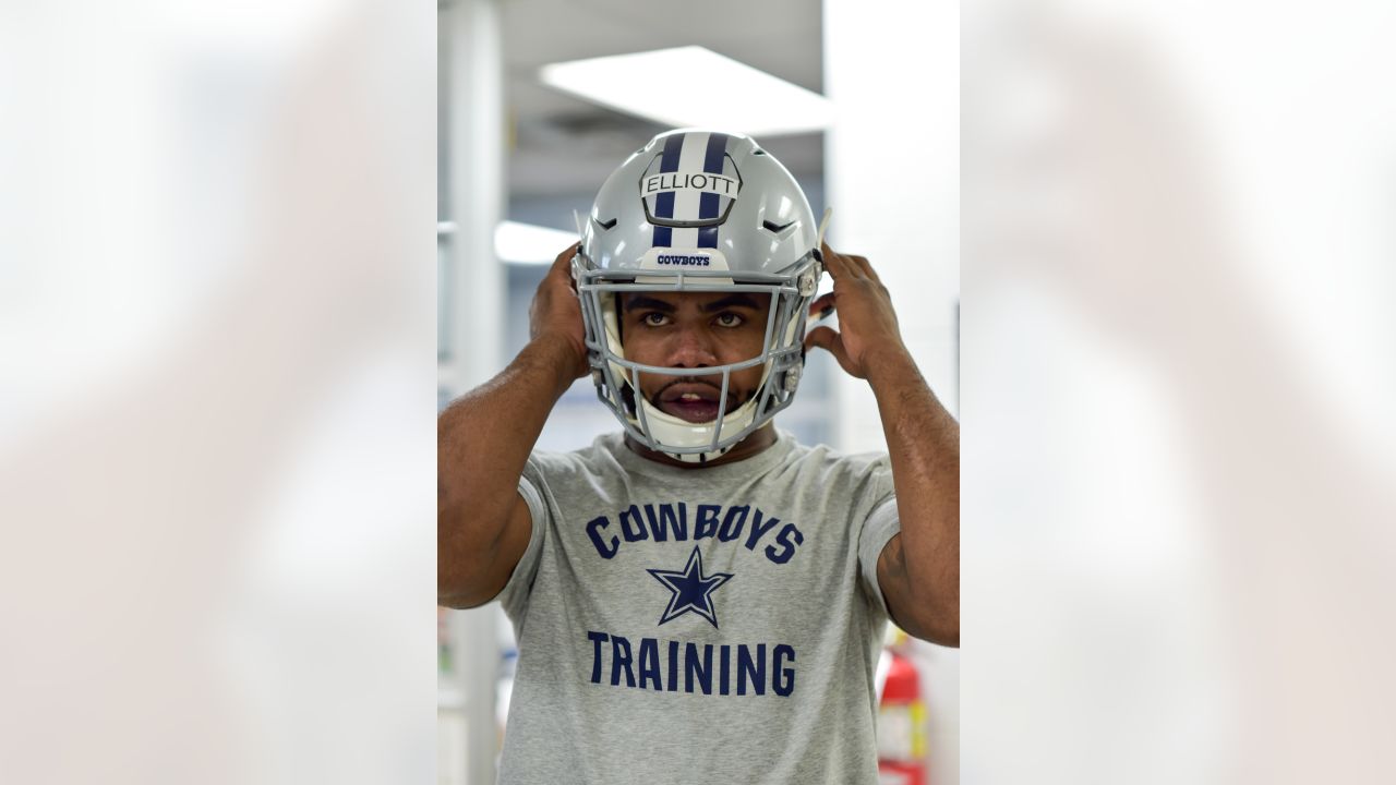 Dallas Cowboys NFL football first-round draft pick Ezekiel Elliott, poses  with his jersey in front of his locker at the team's training facility,  Friday, April 29, 2016, in Irving, Texas. (AP Photo/Tony