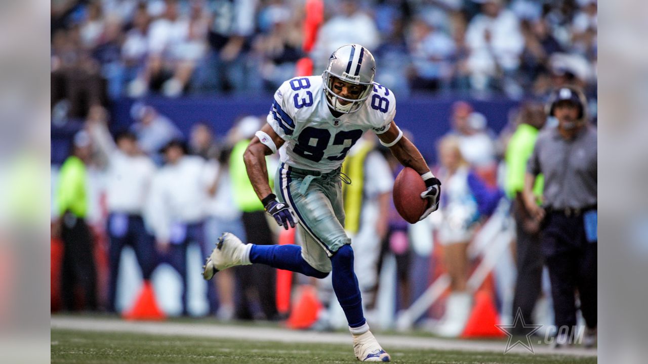 Wide receiver Terry Glenn, of the Dallas Cowboys, returns a pass down  field, in the 3rd quarter, as the Dallas Cowboys face the New England  Patriots, at Gillette Stadium, in Foxboro, Mass