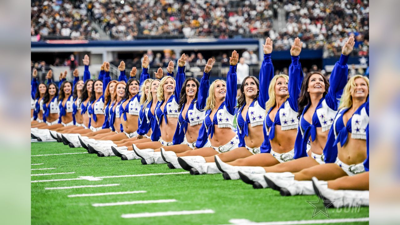 November 19, 2017: A Dallas Cowboys cheerleader escorts former