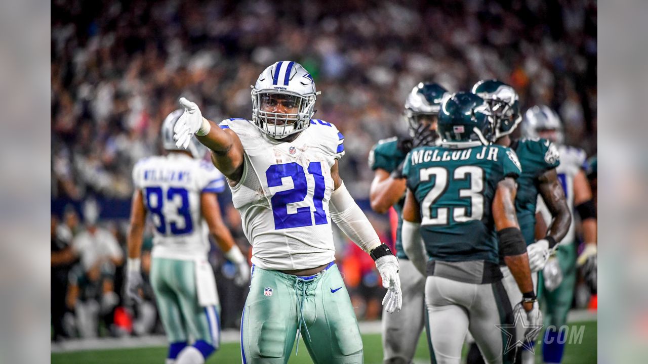 Dallas Cowboys linebacker Sean Lee (50) is congratulated by linebacker  DeMarcus Ware (94) and safety Gerald Sensabaugh (43) after getting a tackle  for a Chicago Bears loss at Cowboy's Stadium in Arlington