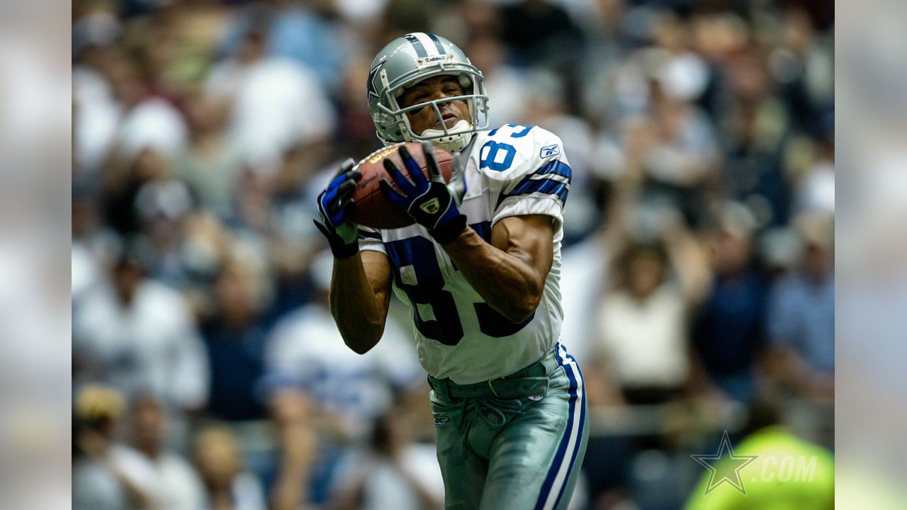 Wide receiver Terry Glenn, of the Dallas Cowboys, returns a pass down  field, in the 3rd quarter, as the Dallas Cowboys face the New England  Patriots, at Gillette Stadium, in Foxboro, Mass