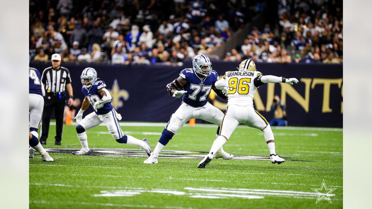 Dallas Cowboys' Osa Odighizuwa (97) and Damontae Kazee (18) celebrate with  Trevon Diggs (7) after Diggs intercepted a pass in the second half of an  NFL football game against the Carolina Panthers