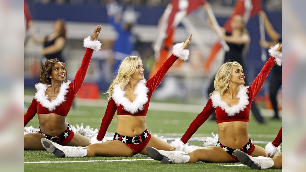 Dallas Cowboys cheerleader performs at halftime in her Santa Claus