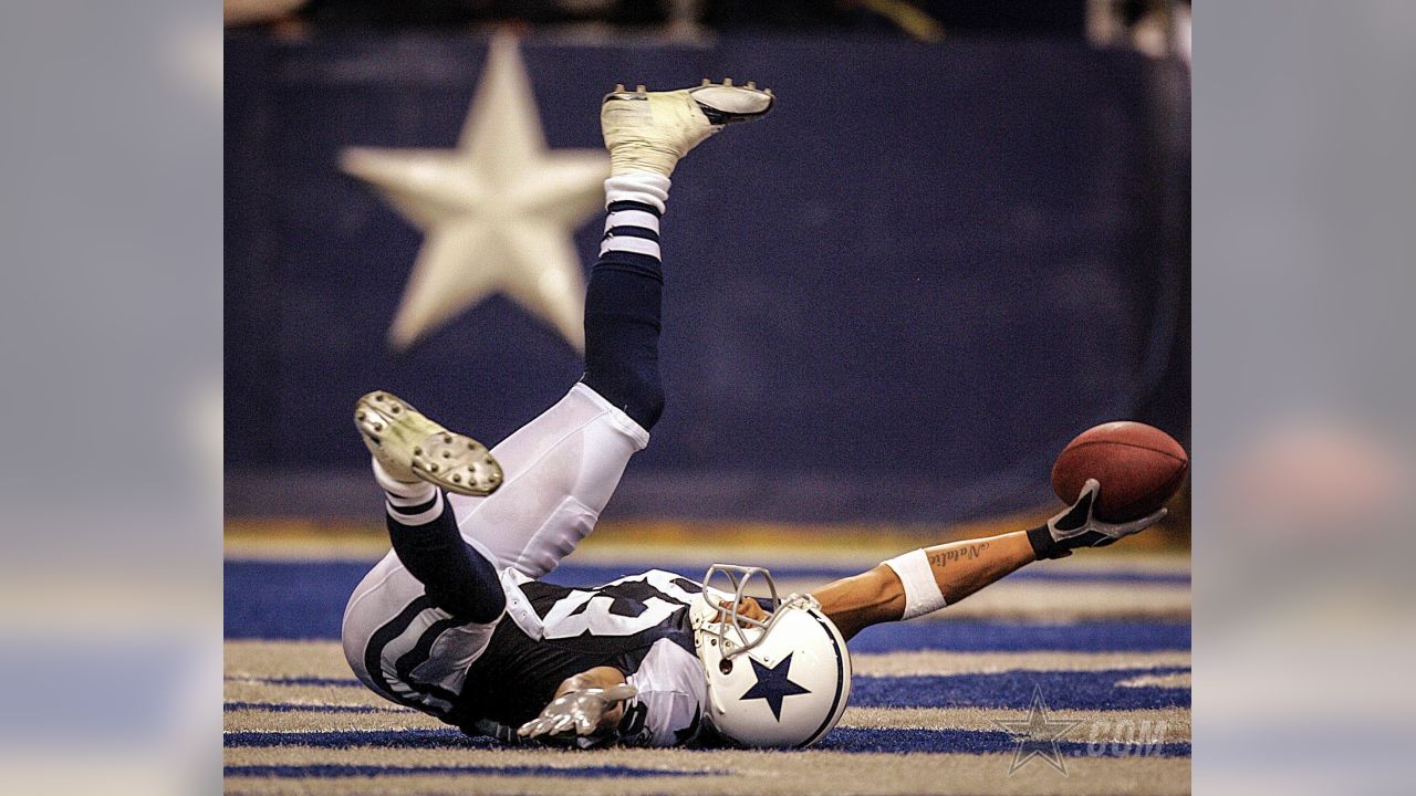 Wide receiver Terry Glenn, of the Dallas Cowboys, returns a pass down  field, in the 3rd quarter, as the Dallas Cowboys face the New England  Patriots, at Gillette Stadium, in Foxboro, Mass