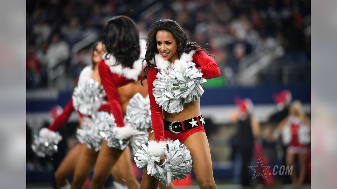 Dallas Cowboys cheerleader performs at halftime in her Santa Claus