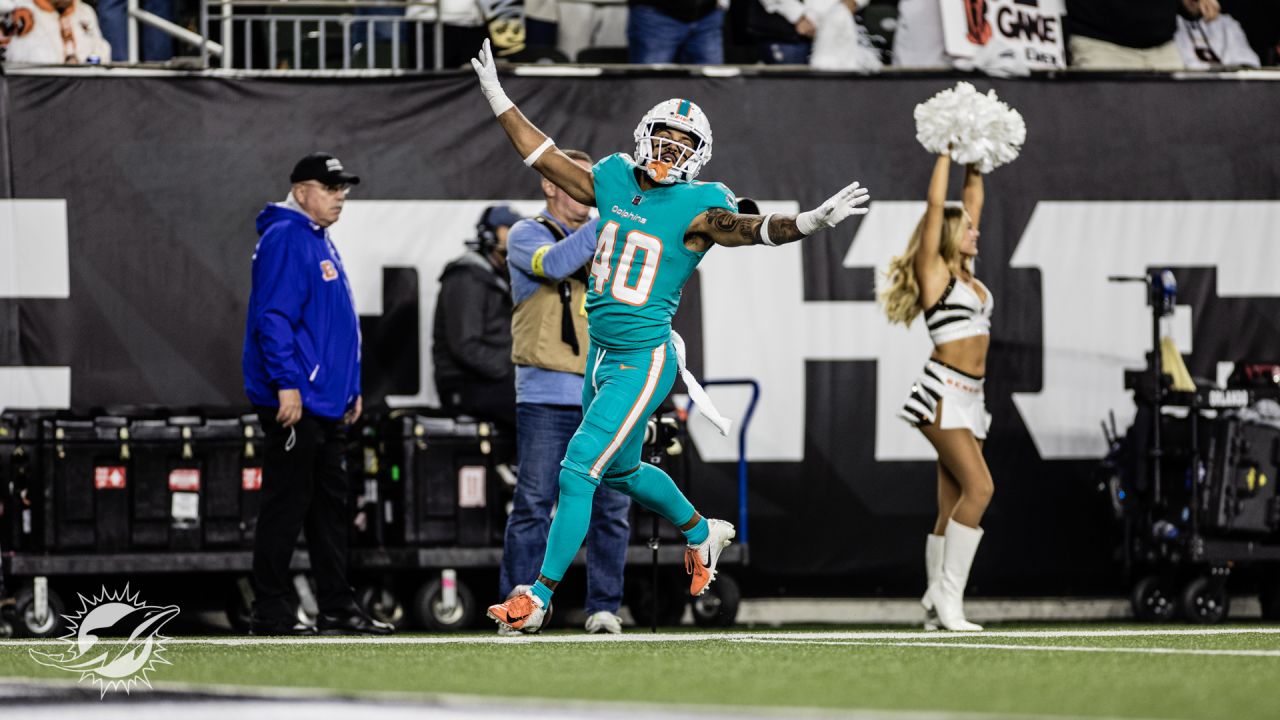 Miami Dolphins vs. Cincinnati Bengals. NFL Game. American Football League  match. Silhouette of professional player celebrate touch down. Screen in  bac Stock Photo - Alamy