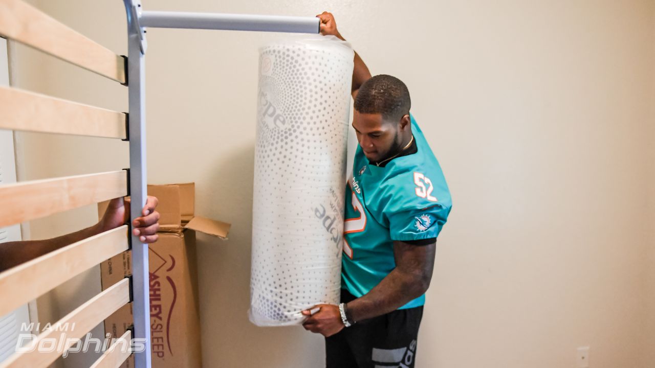 Miami Dolphins defensive players and Ashley HomeStore Deliver Beds