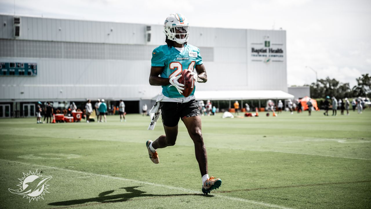 Miami Dolphins quarterback James Blackman (16) and Miami Dolphins running  back Salvon Ahmed (26) does drills during NFL football training camp at  Baptist Health Training Complex in Hard Rock Stadium on Tuesday