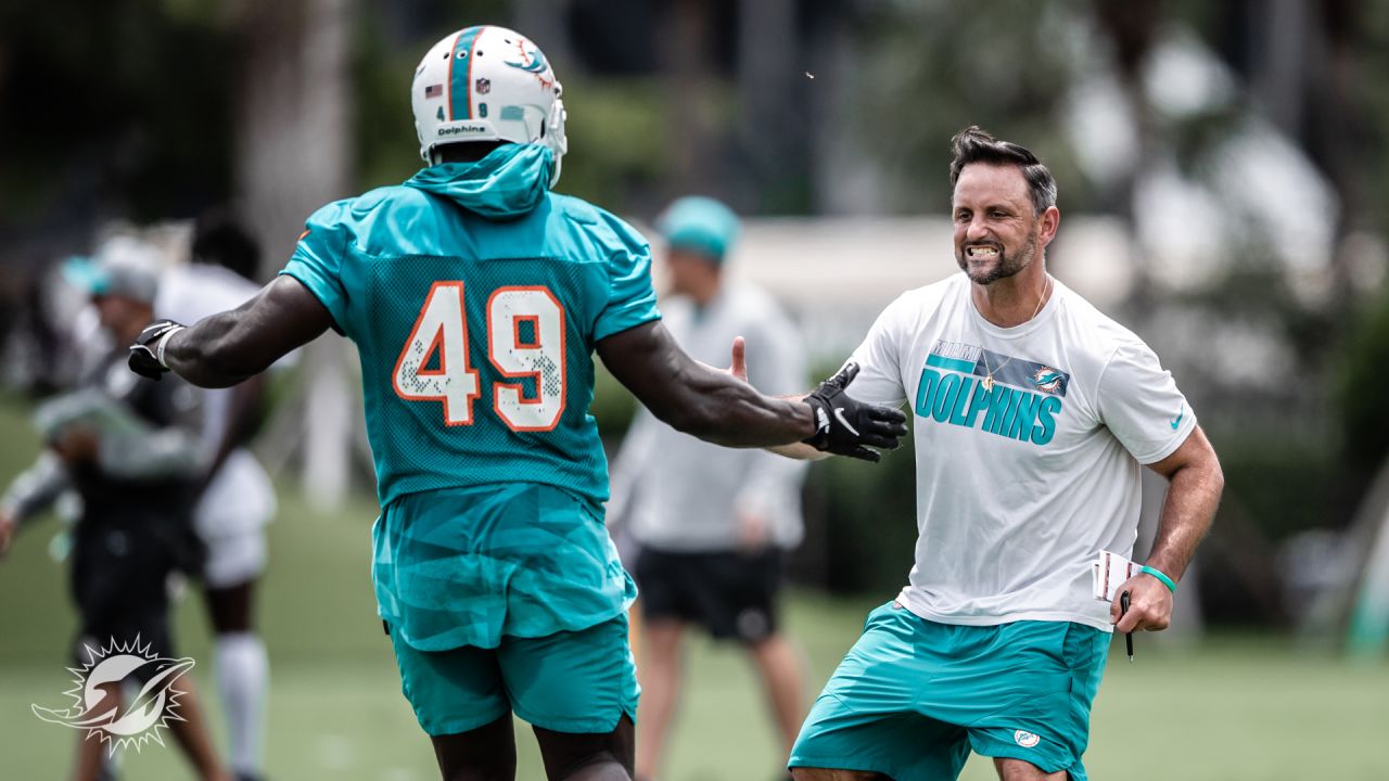 Miami Dolphins linebacker Sam Eguavoen (49) and Miami Dolphins