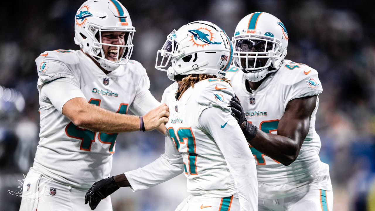 Miami Dolphins linebacker Sam Eguavoen (49) and Miami Dolphins