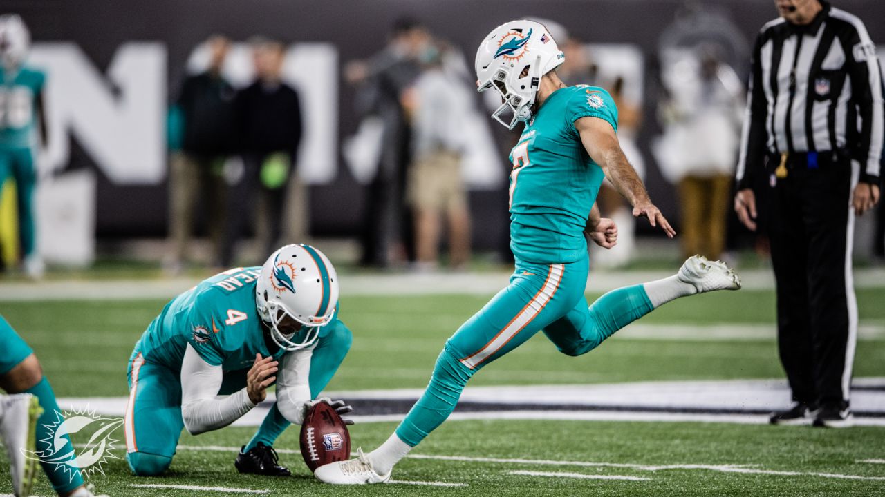 Miami Dolphins vs. Cincinnati Bengals. NFL Game. American Football League  match. Silhouette of professional player celebrate touch down. Screen in  bac Stock Photo - Alamy