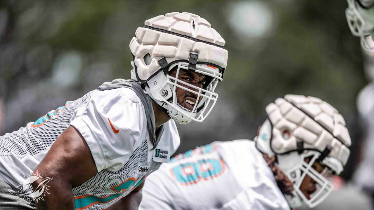 Miami Dolphins guard Austin Jackson (73) and Miami Dolphins guard Michael  Deiter (63) look to block incoming defensive linemen during an NFL football  game against the Tampa Bay Buccaneers, Saturday, Aug. 13