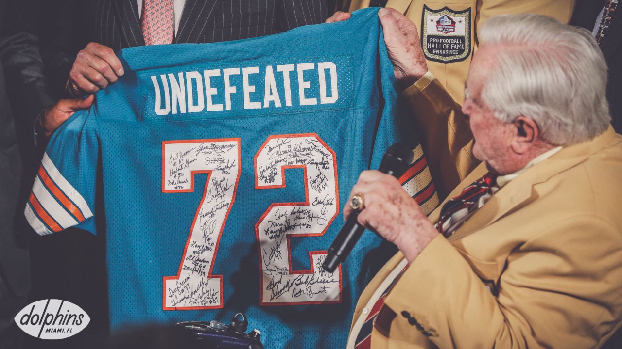 Former Miami Dolphins head coach Don Shula celebrates with teammates of the  1972 Miami Dolphins perfect season team as they were honored during  halftime of the Miami Dolphins Buffalo Bills game at