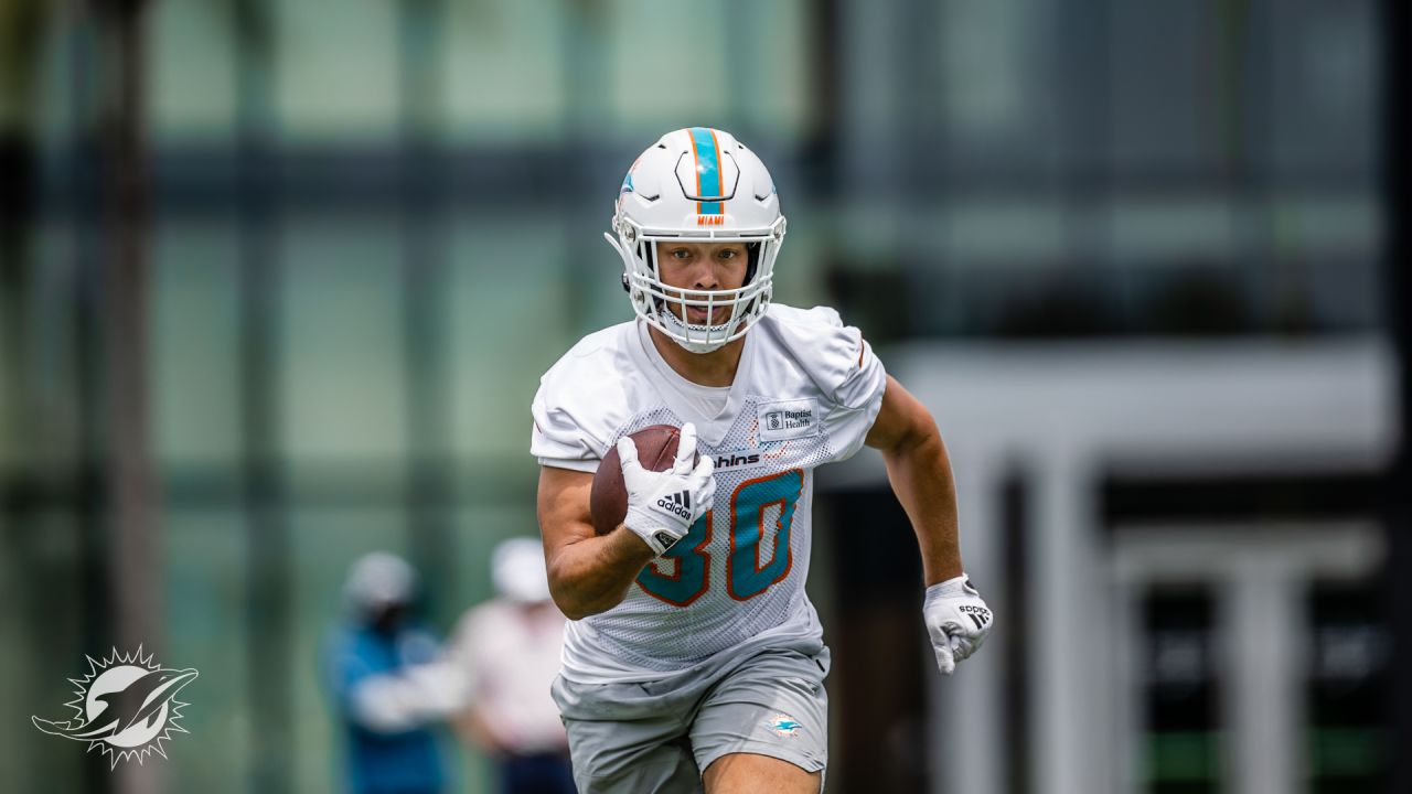 Miami Dolphins fullback Alec Ingold (30) runs with the ball to