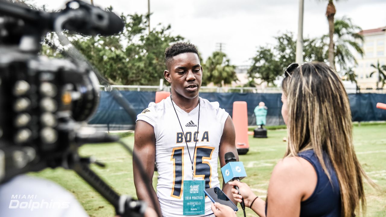 Boca High football team gets special Dolphins visit