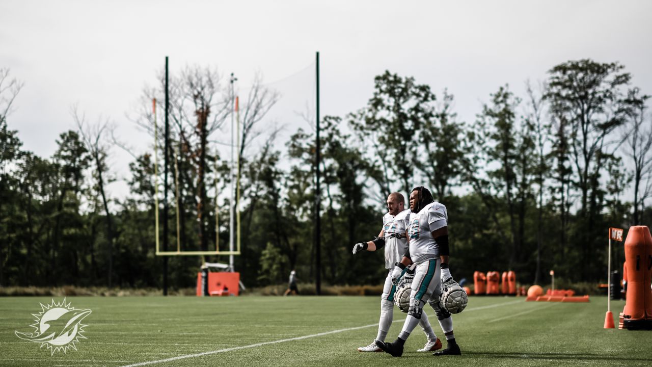 Miami Dolphins offensive tackle Liam Eichenberg (74) walks on the