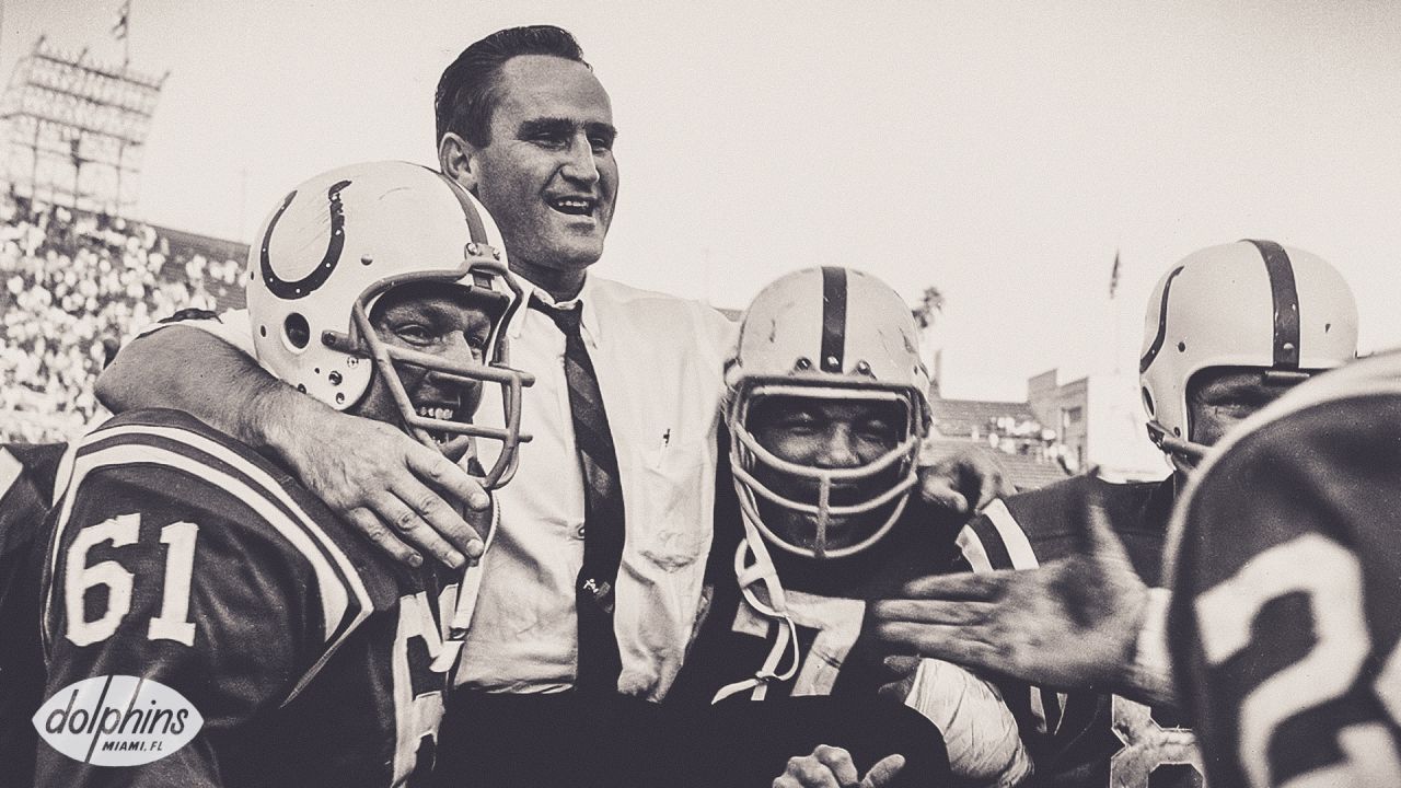 Coach of the Miami Dolphins' perfect season, Don Shula, with quarterback  Bob Griese during a halftime ceremony celebrating the undefeated 1972 team  as the Dolphins play host to the Cincinnati Bengals on