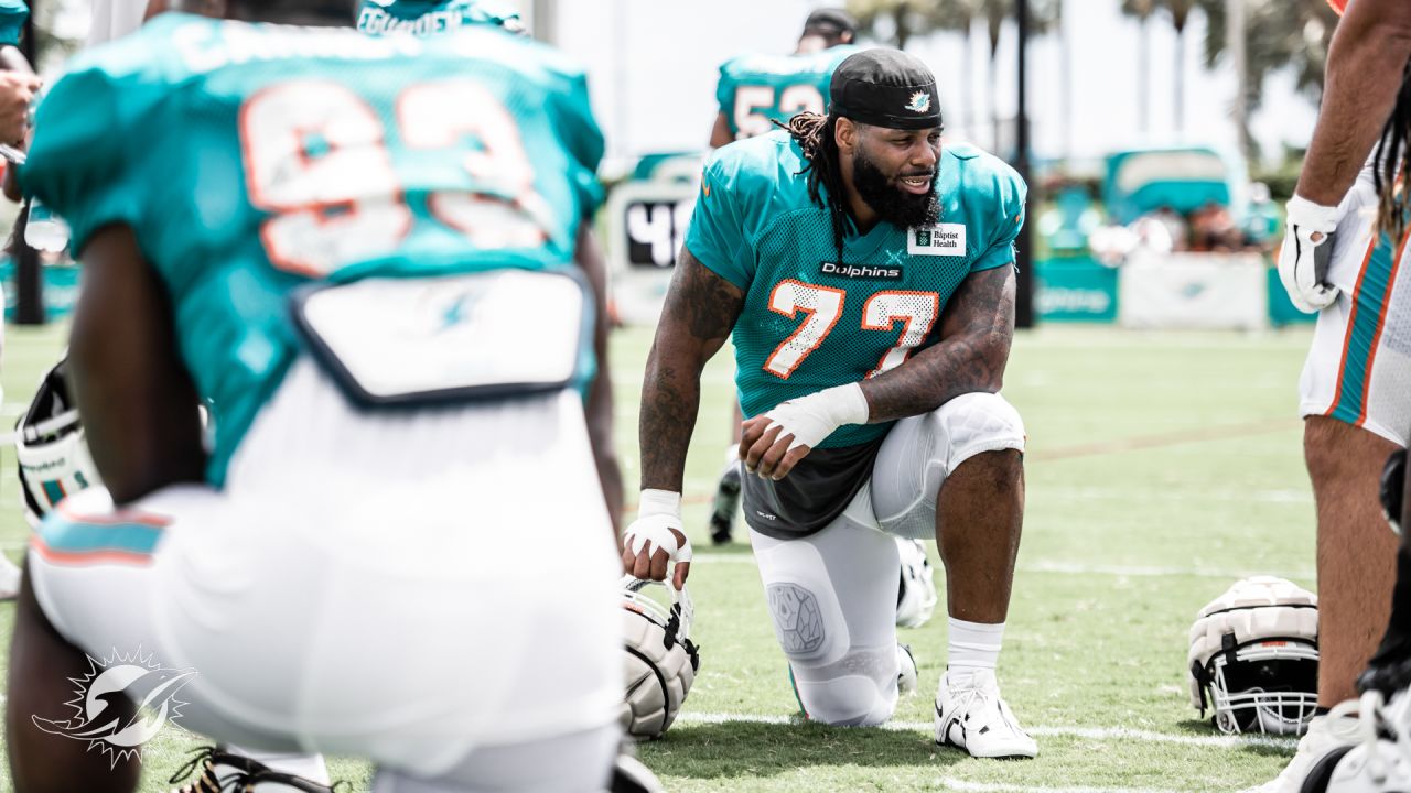 Miami Dolphins defensive tackle John Jenkins (77) celebrates after