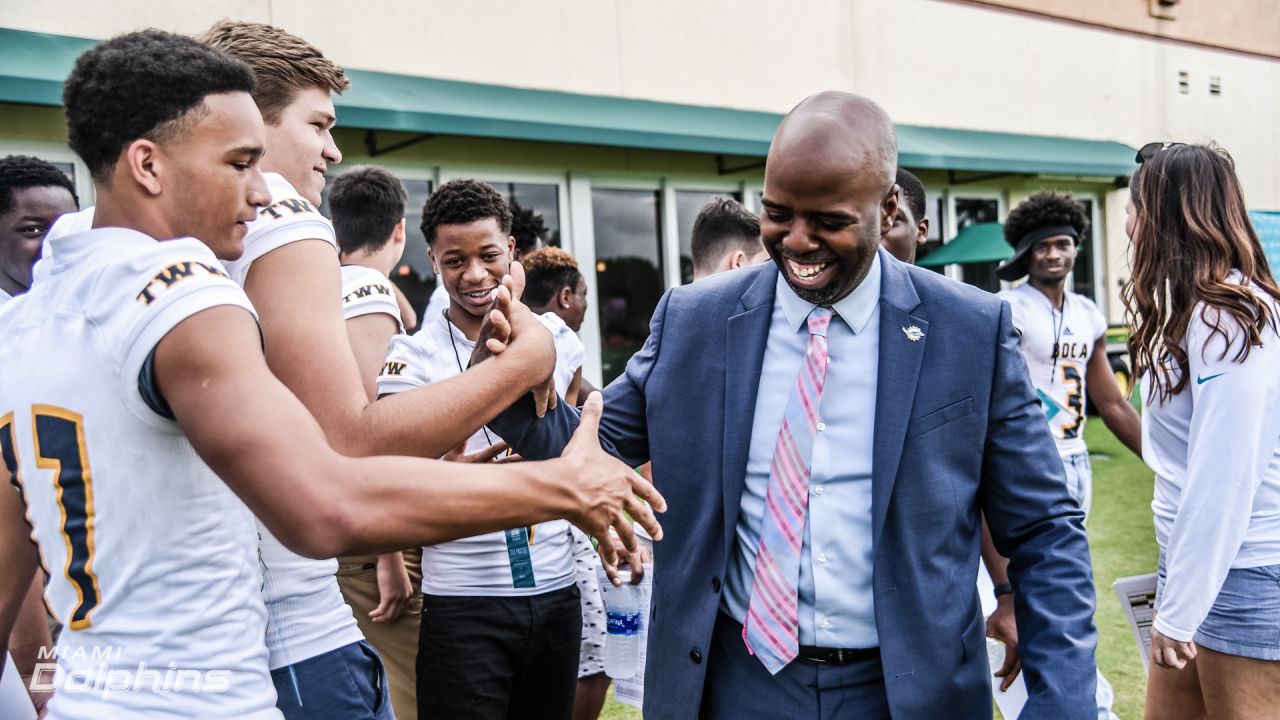 Boca High football team gets special Dolphins visit