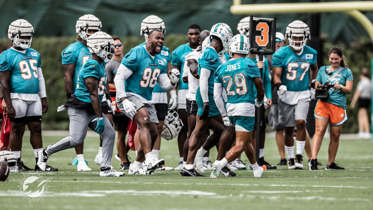 MIAMI GARDENS, FL - JULY 29: Miami Dolphins quarterback Too Tagovaloa (1)  listens to a coach in between drills during the Miami Dolphins training camp  on Friday, July 29, 2022 at Baptist