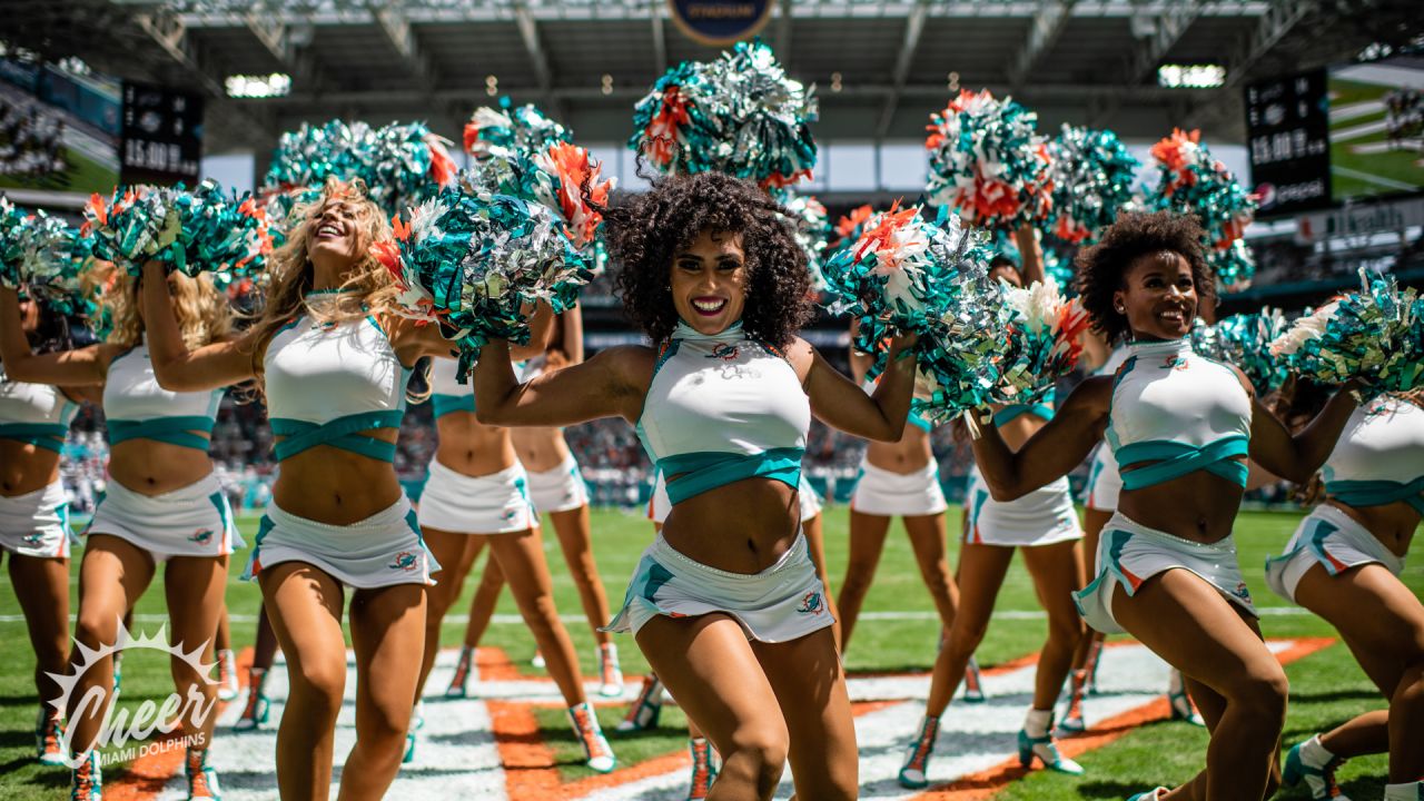 Miami Dolphins Cheerleaders entertain the crowd in Christmas attire during  the first half against the Buffalo Bills at Sun Life Stadium on December  23, 2012 in Miami, Florida. The Miami Dolphins beat