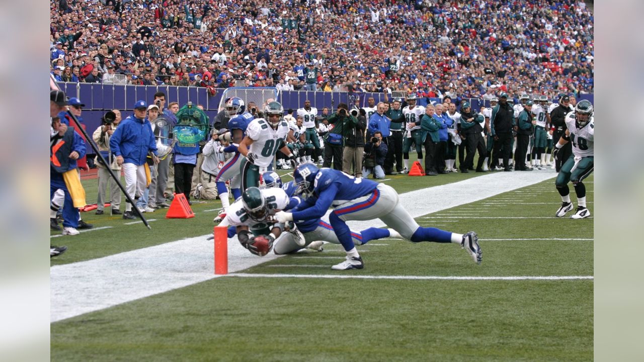 Philadelphia Eagles Brian Westbrook jumps over the pile and into the  endzone for a 1 yard touchdown late in the 2nd quarter at Giants Stadium in  East Rutherford, New Jersey on December