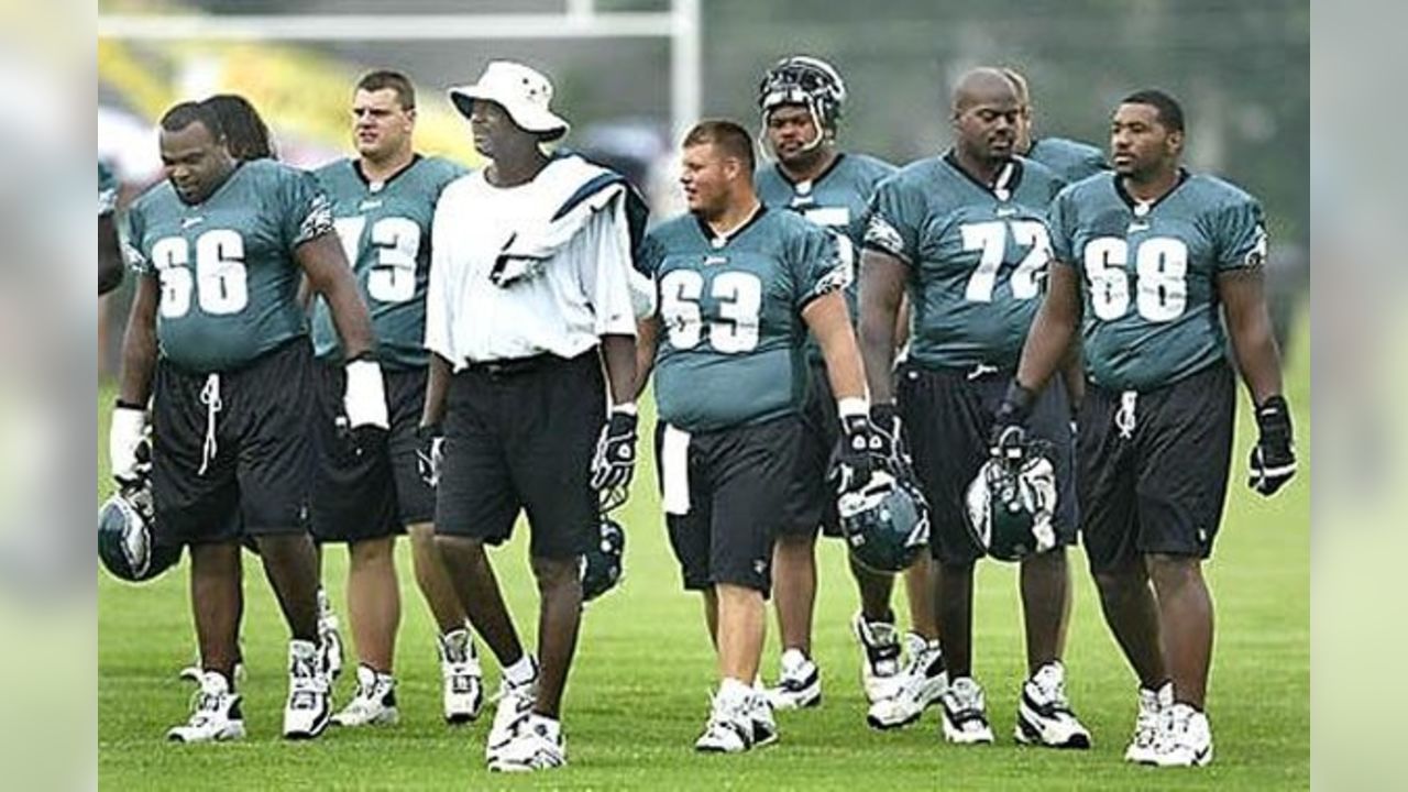 Philadelphia Eagles Alum Fred Barnett, center, poses with his team