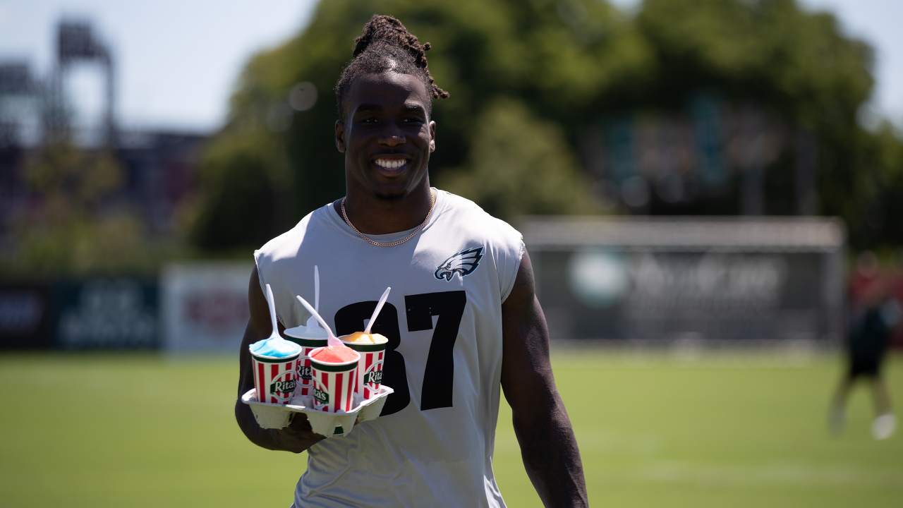 Philadelphia Eagles' Jalen Carter hands his jersey over to a member of the  Military during practice at NFL football training camp, Sunday, July 30,  2023, in Philadelphia. (AP Photo/Chris Szagola Stock Photo 