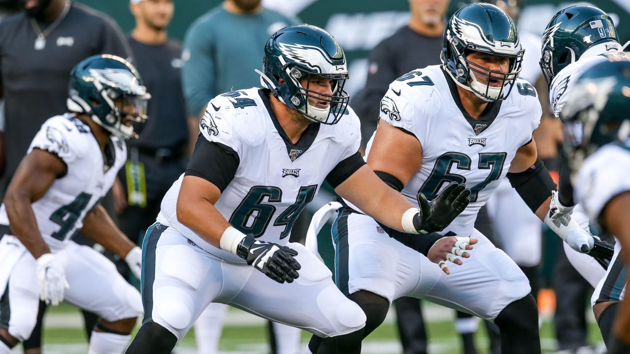 New York Giants quarterback Davis Webb (12) runs over Philadelphia Eagles  safety Reed Blankenship (32) and scores a touchdown on a 14-yard run during  the fourth quarter of an NFL football game