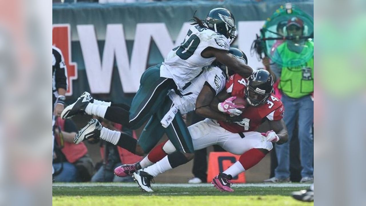 Philadelphia Eagles linebacker Ernie Sims is airborne as he hangs