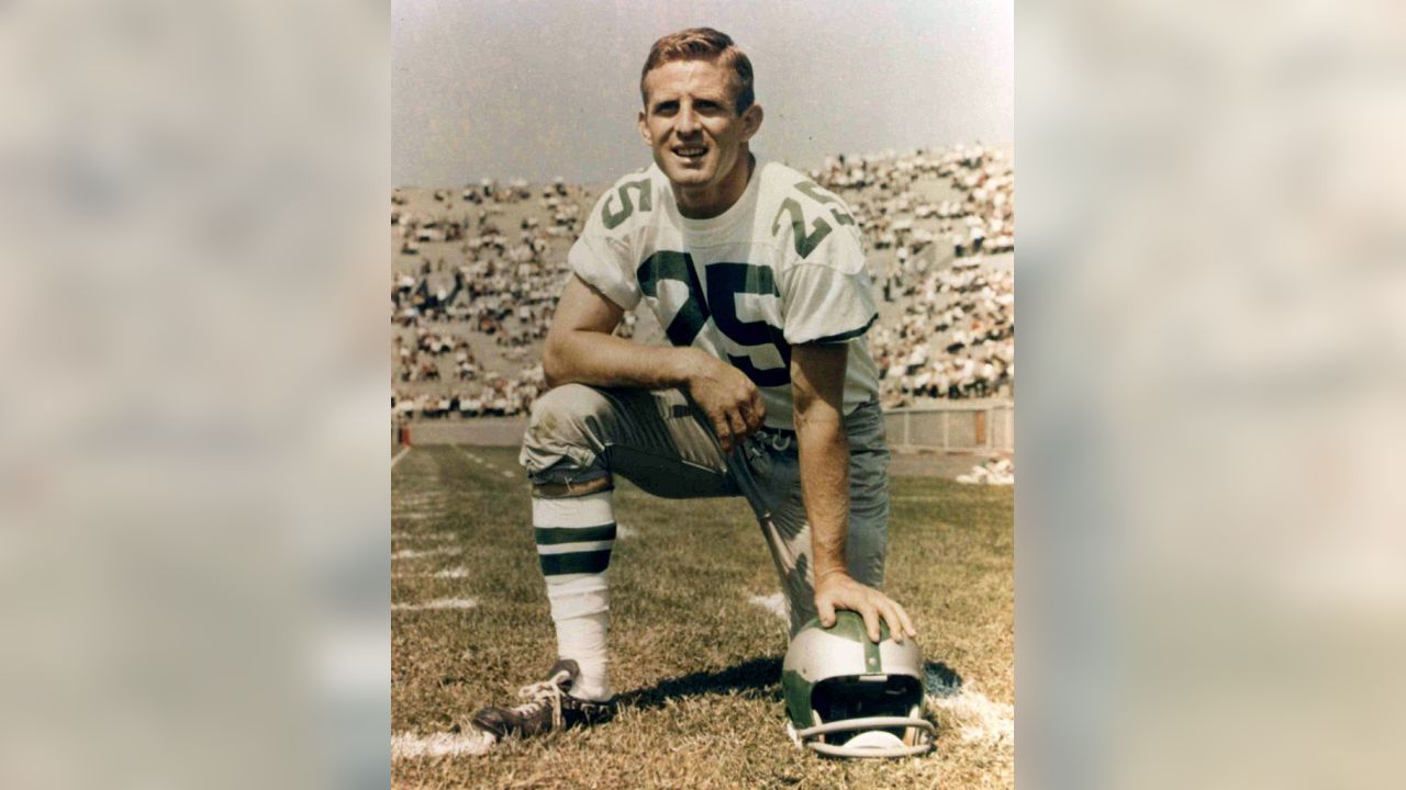 Tommy McDonald, All-America Oklahoma back, poses with a new number, head  gear and ball after he signed with the Philadelphia Eagles, Jan. 14, 1957,  to start a professional career in the NFL.