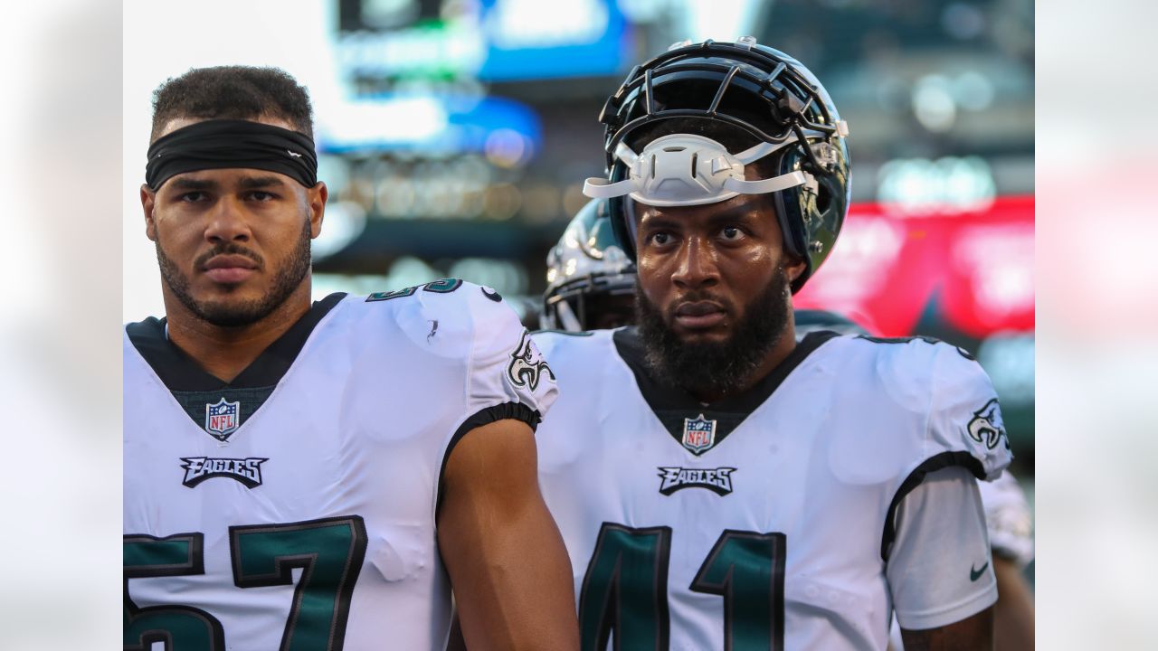 Philadelphia Eagles linebacker Nakobe Dean (17) and defensive tackle Jordan  Davis (90) head off the field following the NFL football game against the  New York Giants, Sunday, Jan. 8, 2023, in Philadelphia. (