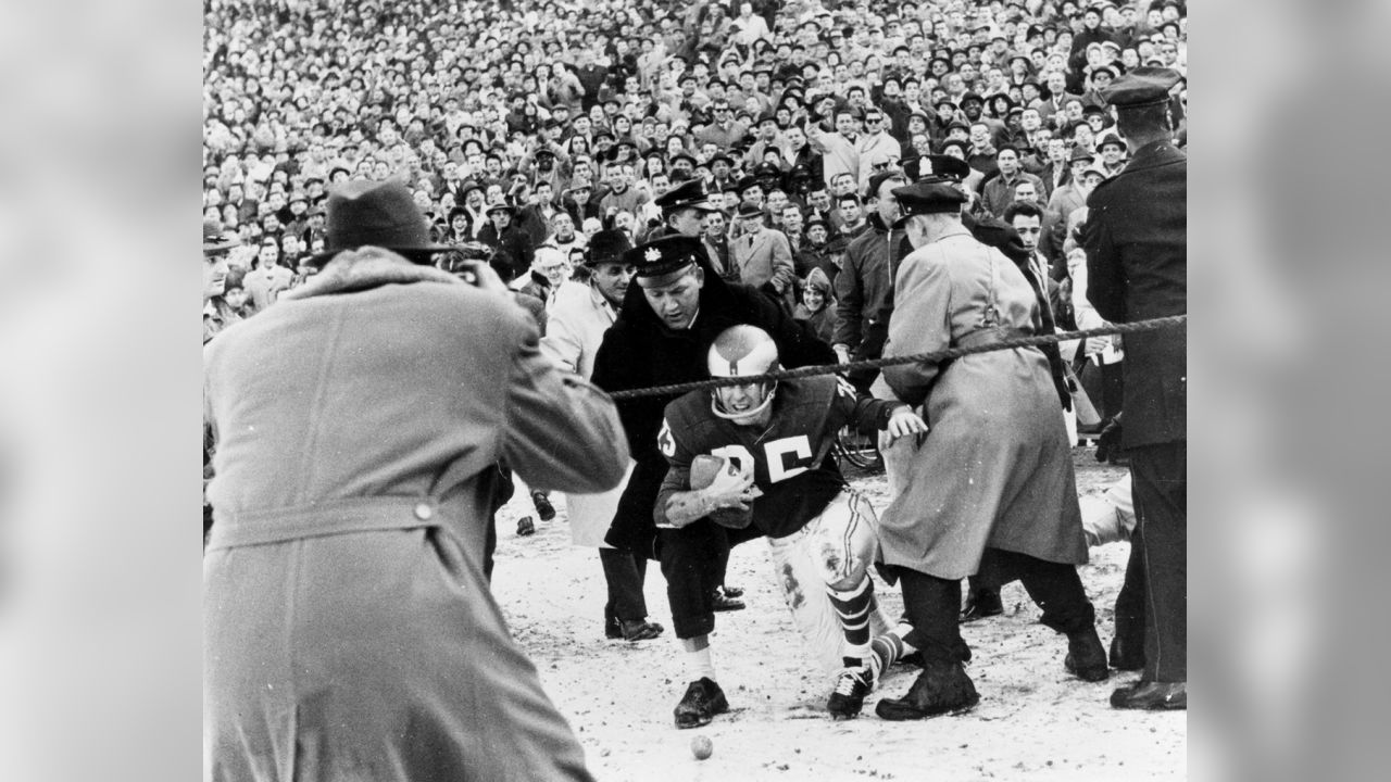 Tommy McDonald, All-America Oklahoma back, poses with a new number, head  gear and ball after he signed with the Philadelphia Eagles, Jan. 14, 1957,  to start a professional career in the NFL.