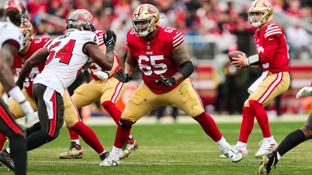 San Francisco 49ers guard Aaron Banks (65) blocks during an NFL