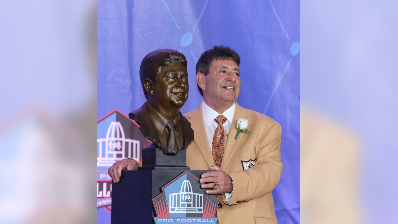 Former NFL owner Edward DeBartolo Jr., right, and his daughter Lisa  DeBartolo pose with a bust of himself during an induction ceremony at the  Pro Football Hall of Fame, Saturday, Aug. 6