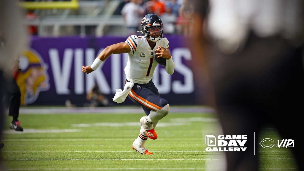 Chicago Bears wide receiver Darnell Mooney (11) carries the ball during the  second half of an NFL football game against the Minnesota Vikings, Sunday,  Oct. 9, 2022 in Minneapolis. (AP Photo/Stacy Bengs