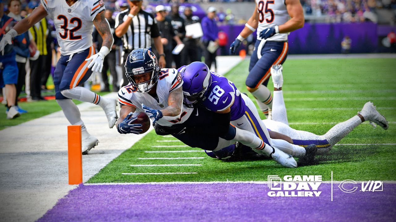 Chicago Bears wide receiver Darnell Mooney (11) carries the ball during the  second half of an NFL football game against the Minnesota Vikings, Sunday,  Oct. 9, 2022 in Minneapolis. (AP Photo/Stacy Bengs