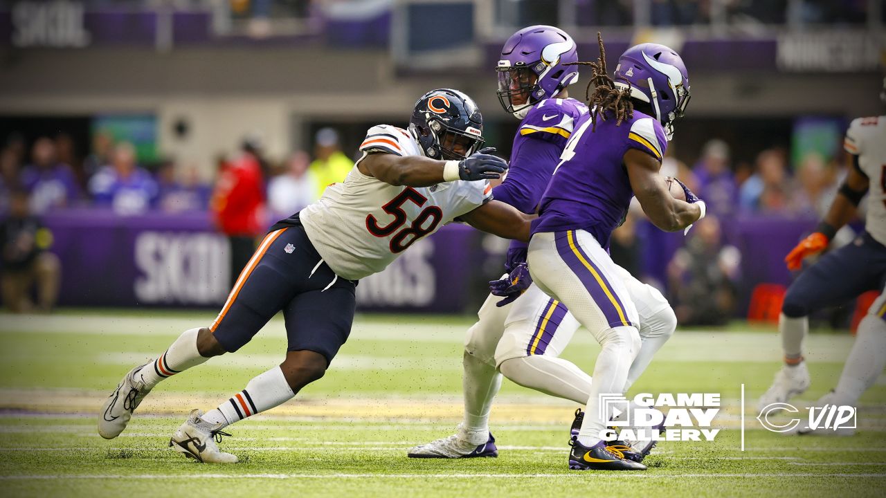 Chicago Bears wide receiver Darnell Mooney (11) carries the ball during the  second half of an NFL football game against the Minnesota Vikings, Sunday,  Oct. 9, 2022 in Minneapolis. (AP Photo/Stacy Bengs