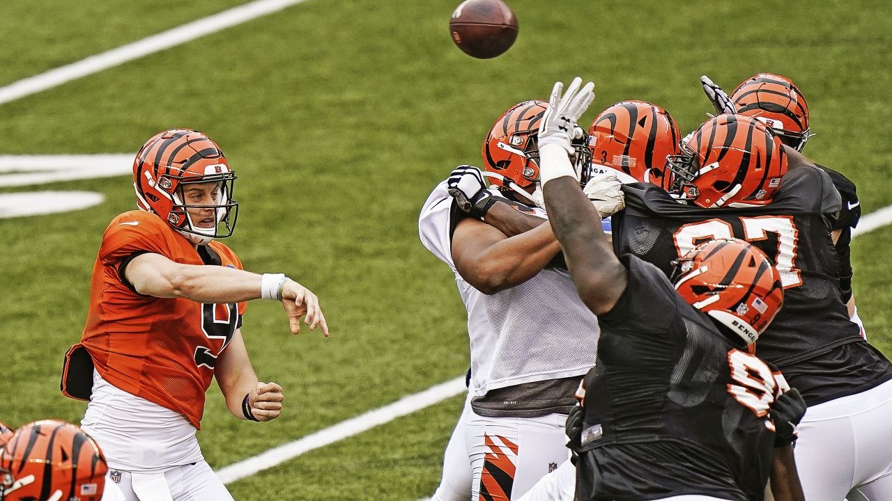 Cincinnati Bengals quarterback Joe Burrow (9) throws a pass during an NFL football team scrimmage in Cincinnati, Sunday, Aug. 30, 2020. (AP Photo/Bryan Woolston)