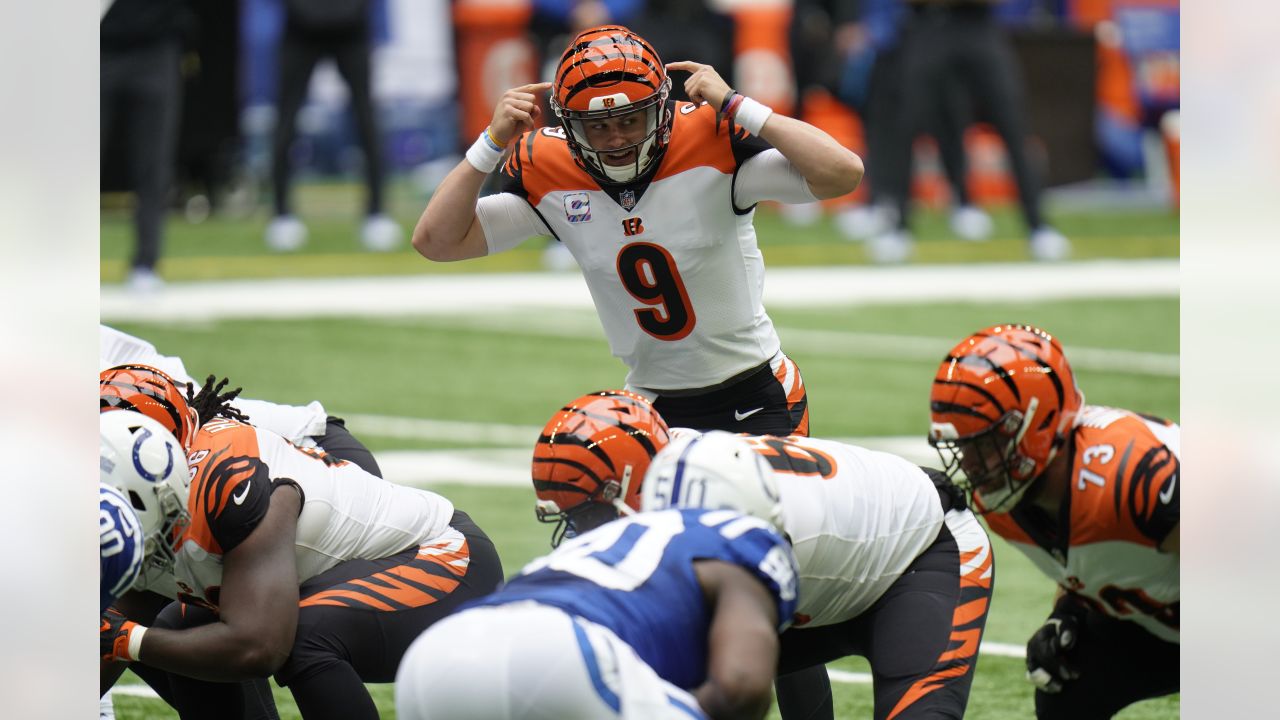 Cincinnati Bengals quarterback Joe Burrow (9) is tackled by Miami