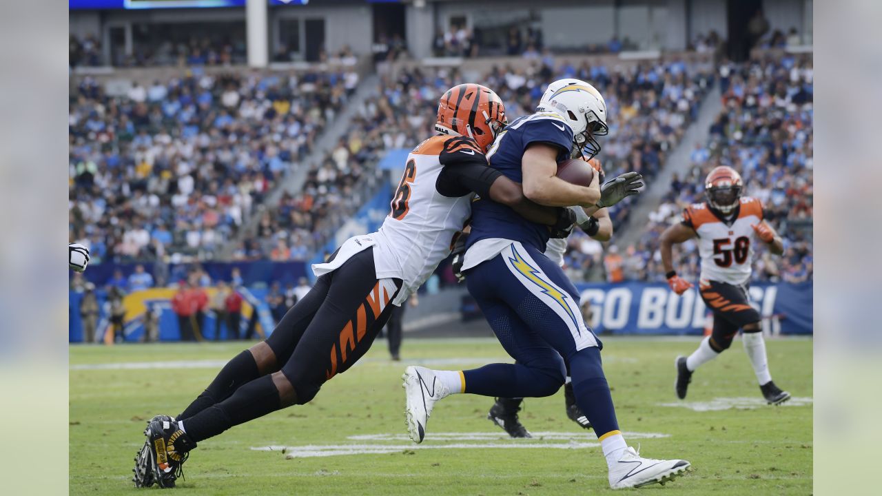 Los Angeles Chargers quarterback Philip Rivers, right, is sacked by Cincinnati Bengals defensive end Carlos Dunlap during the first half of an NFL football game Sunday, Dec. 9, 2018, in Carson, Calif. (AP Photo/Mark J. Terrill)