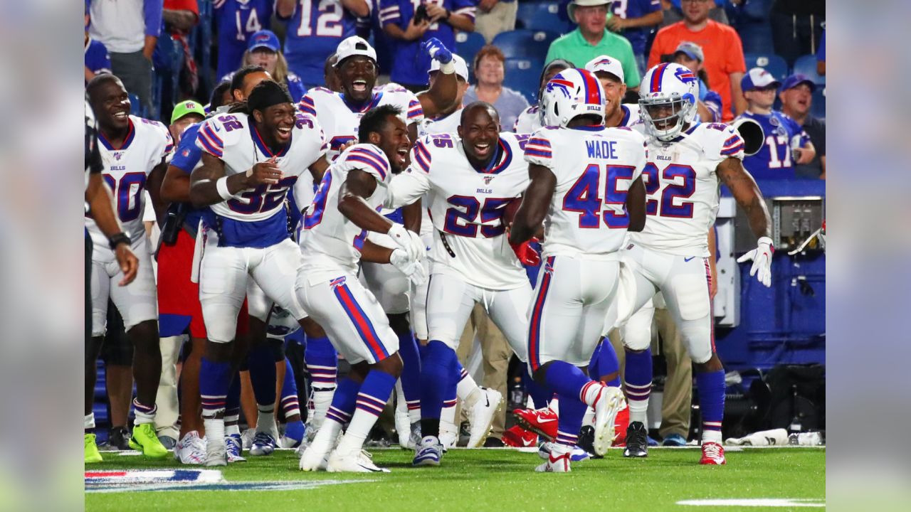 Buffalo Bills' LeSean McCoy, center, celebrates with Christian Wade (45)  after Wade scored a touchdown during the second half of an NFL preseason  football game against the Indianapolis Colts, Thursday, Aug. 8