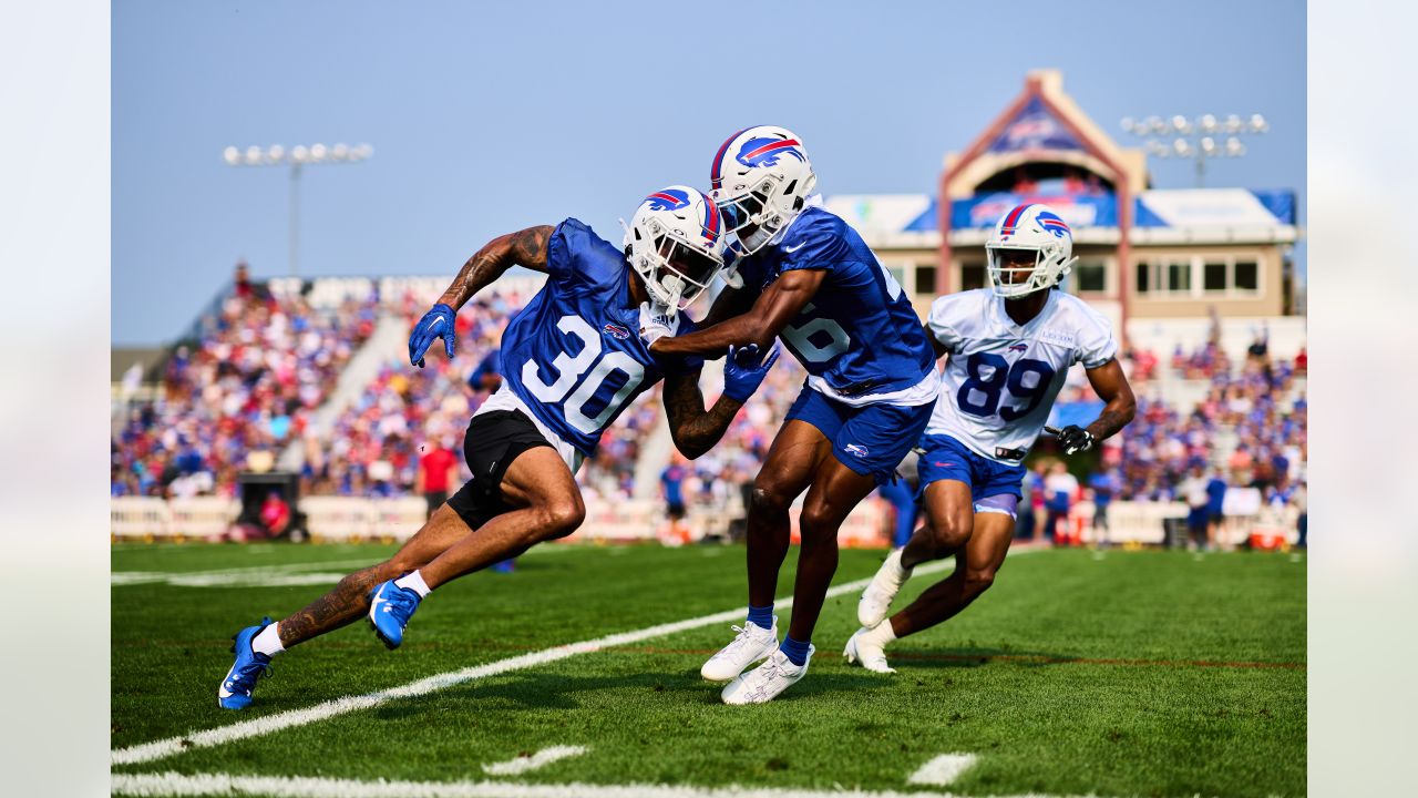 FILE - Buffalo Bills quarterback Josh Allen (17) signs a bottle of barbecue  sauce for a fan after practice at the NFL football team's training camp in  Pittsford, N.Y., Thursday, July 27