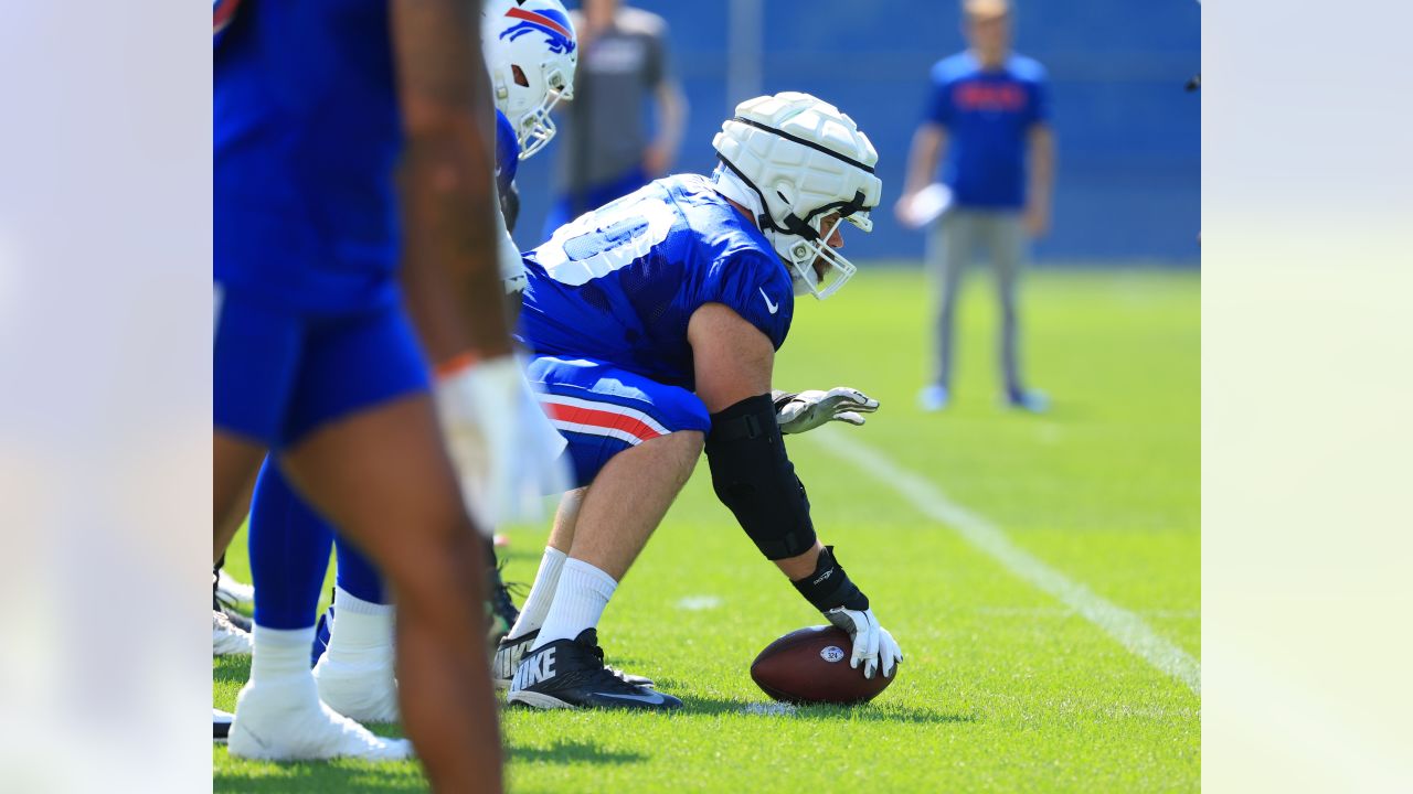 Buffalo Bills' Tre'Davious White sneaks a peak at Baltimore Ravens' play  sheets blown onto field