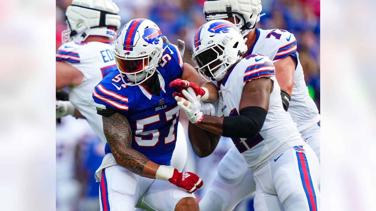 Josh Allen wears red Buffalo Bills helmet at Highmark Stadium