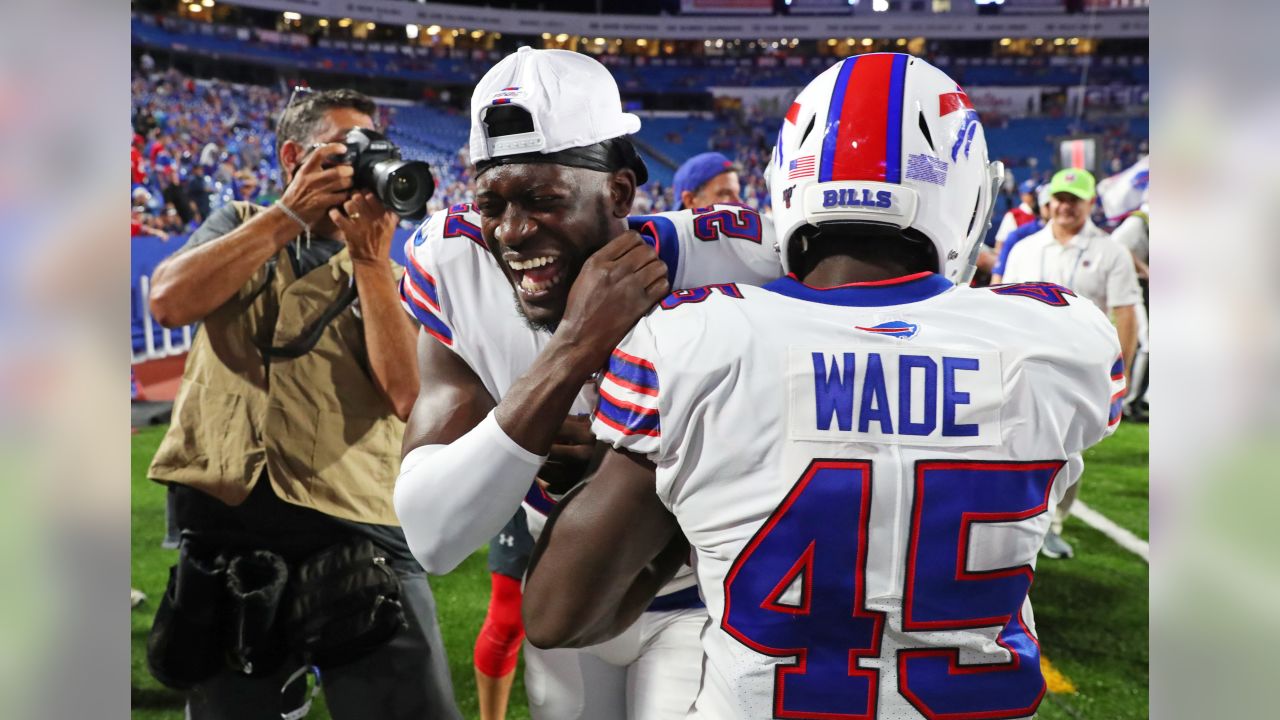 Buffalo Bills' Shaq Lawson, left, greets Denver Broncos' DeShawn