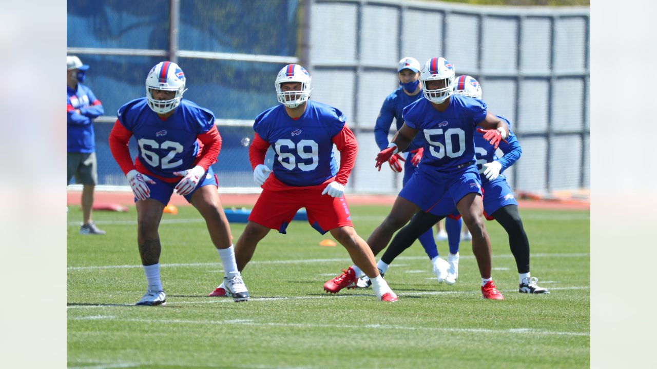 FILE - Buffalo Bills defensive end Greg Rousseau (50) runs a drill during  an NFL football rookie minicamp in Orchard Park, N.Y., in this Friday, May  14, 2021, file photo. Bills Safety