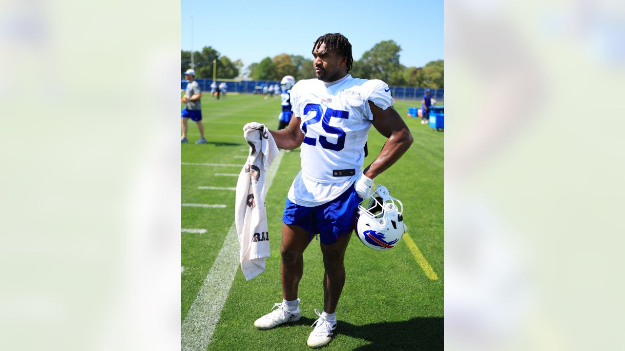 Buffalo Bills' Tre'Davious White sneaks a peak at Baltimore Ravens' play  sheets blown onto field