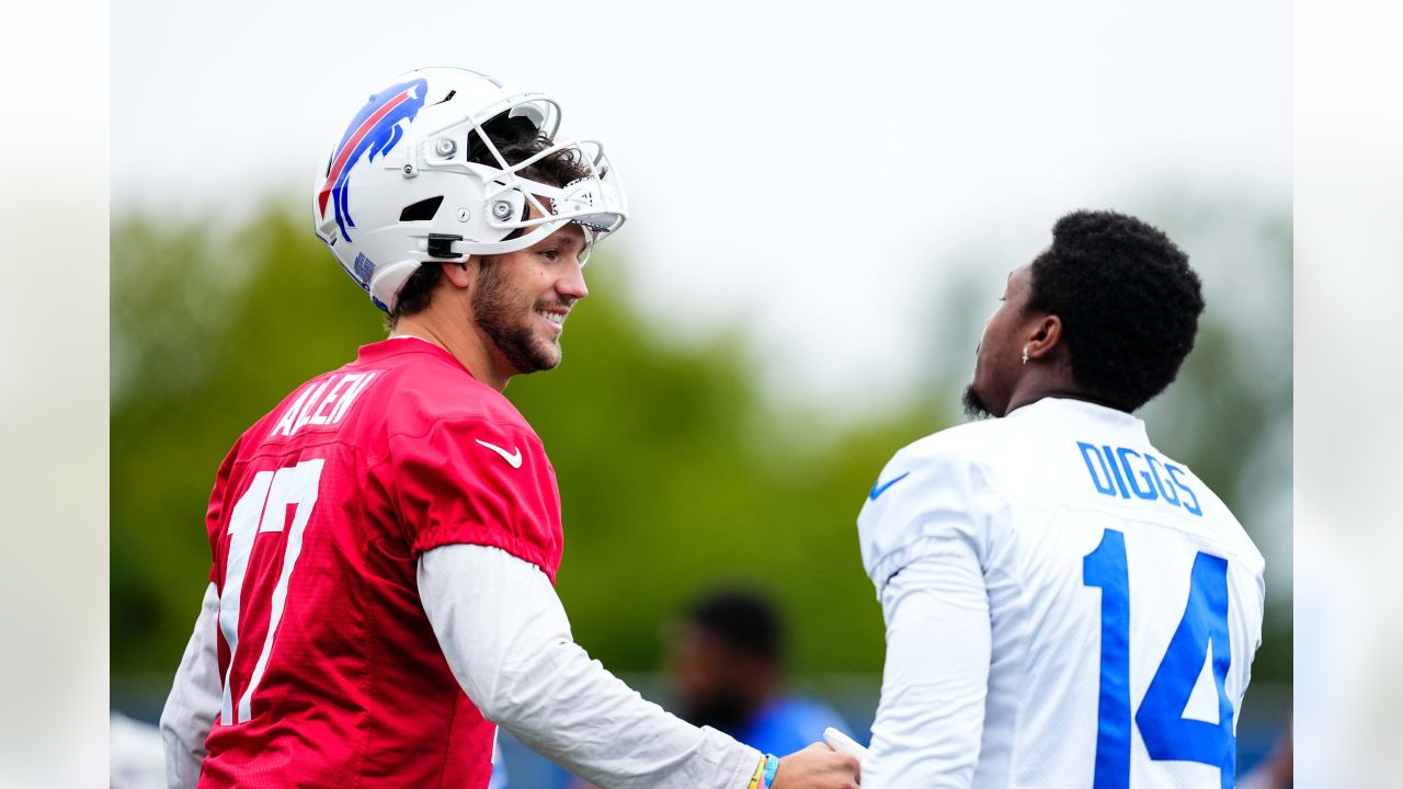 Bills undrafted free agent Alec Anderson celebrates signing with toss  through table